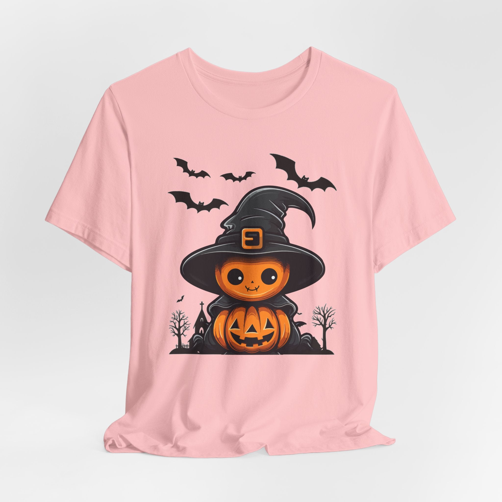 Pink t-shirt with Halloween-themed design featuring a pumpkin in a witch hat on a light gray background.