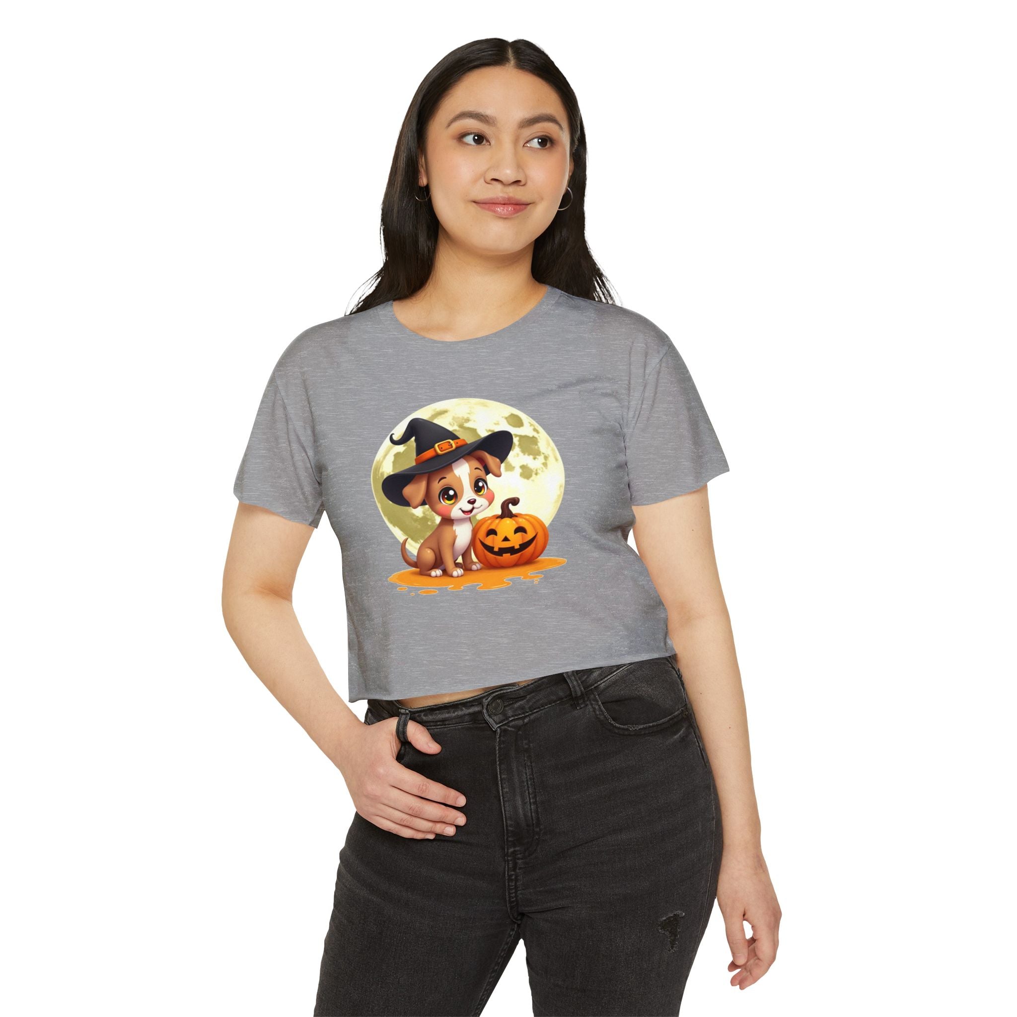 Woman wearing a gray t-shirt with a Halloween-themed graphic design.