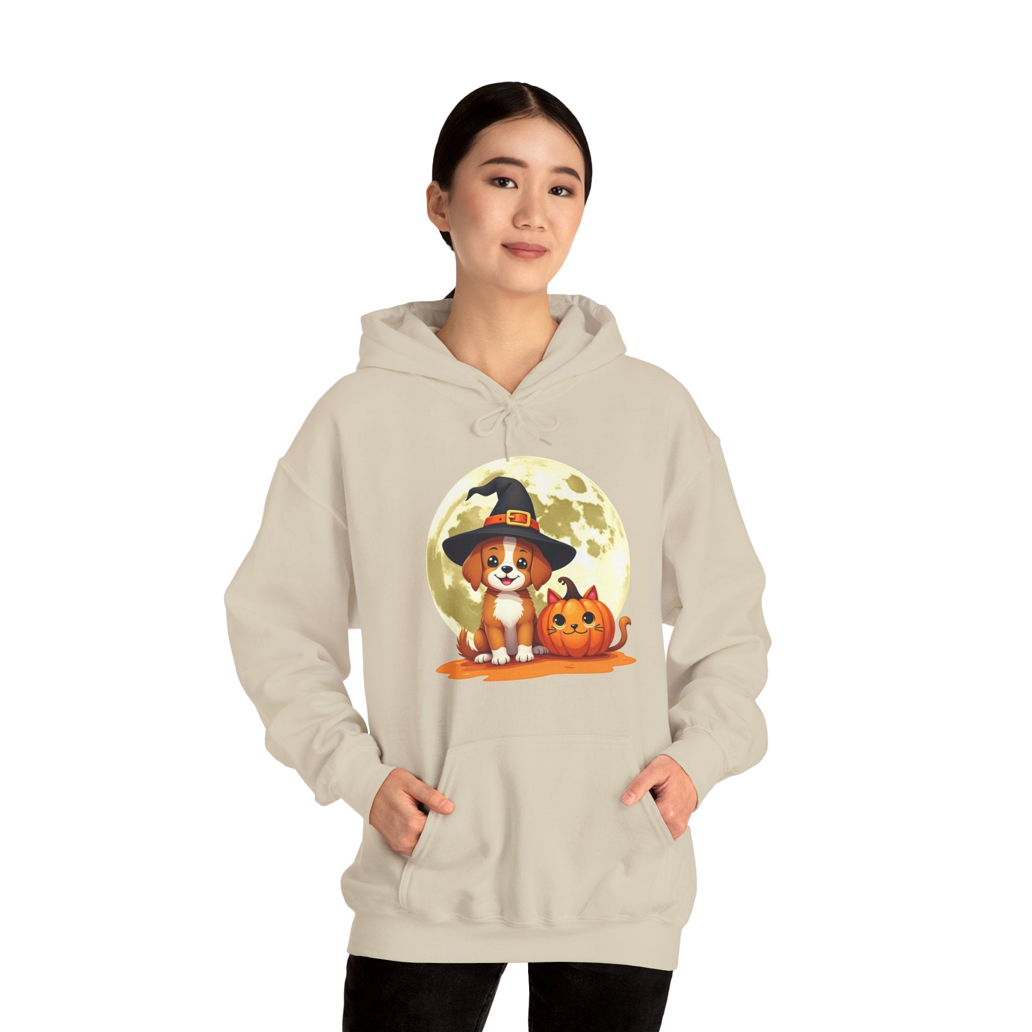 Person wearing a beige hoodie with a Halloween-themed design featuring a dog and pumpkin.
