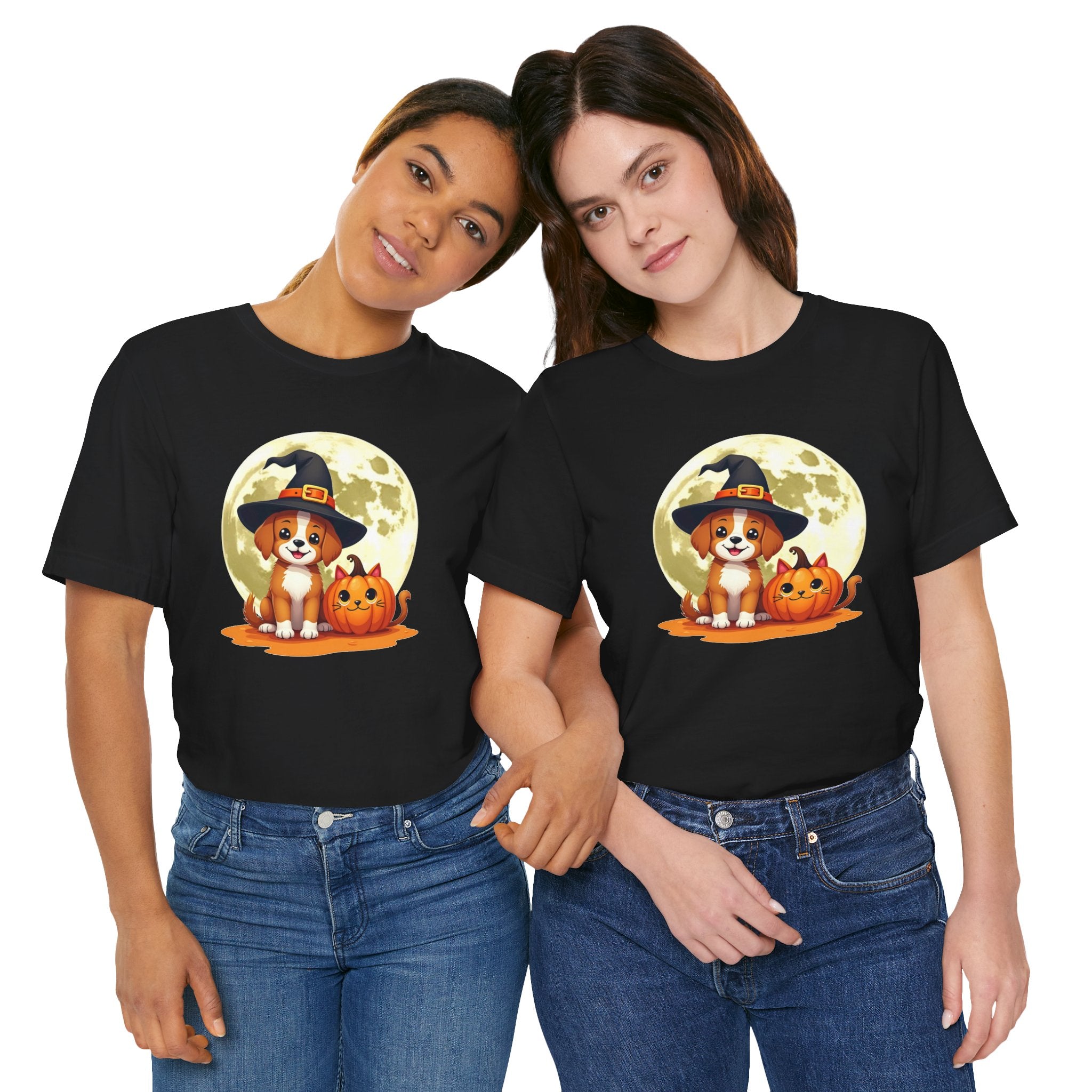 Two people wearing black t-shirts with a Halloween-themed design featuring a dog in a witch hat and pumpkins.