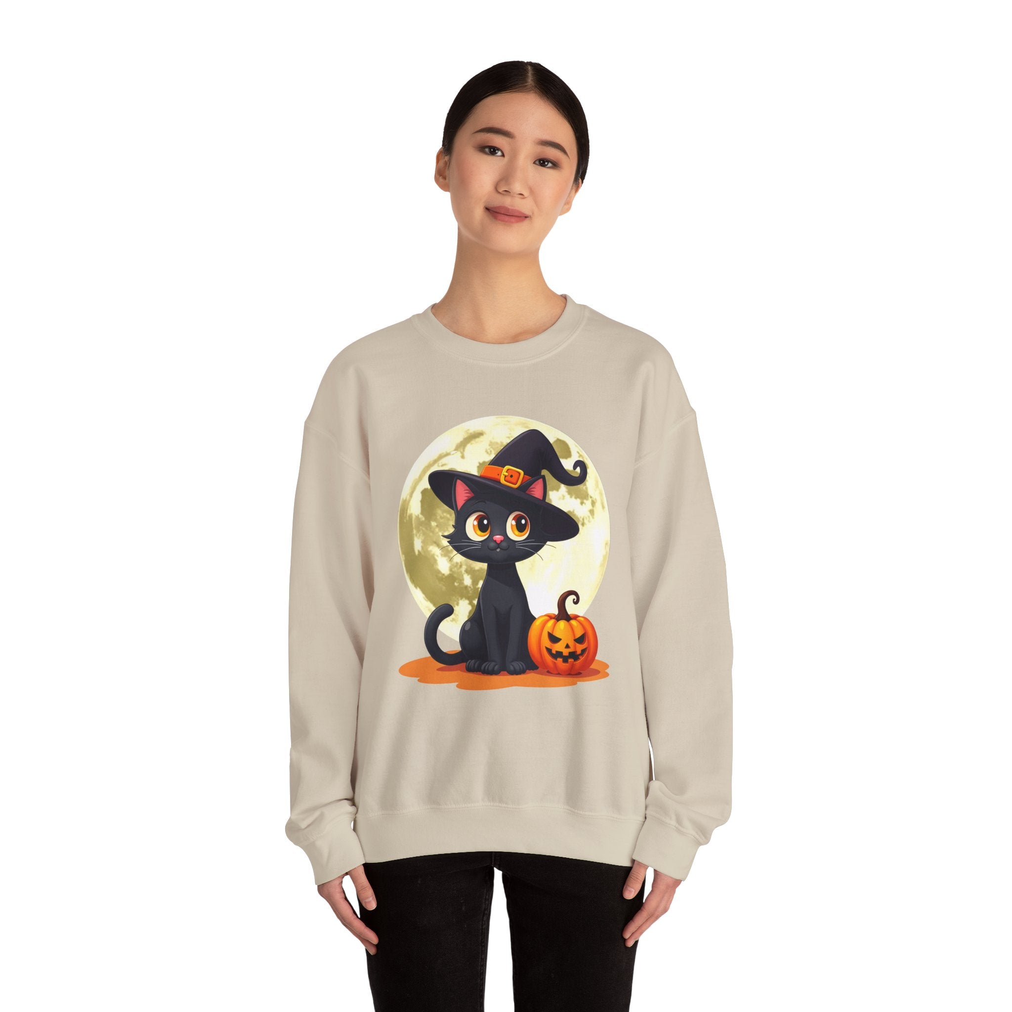 Person wearing a beige sweatshirt with a Halloween design featuring a black cat and pumpkin.