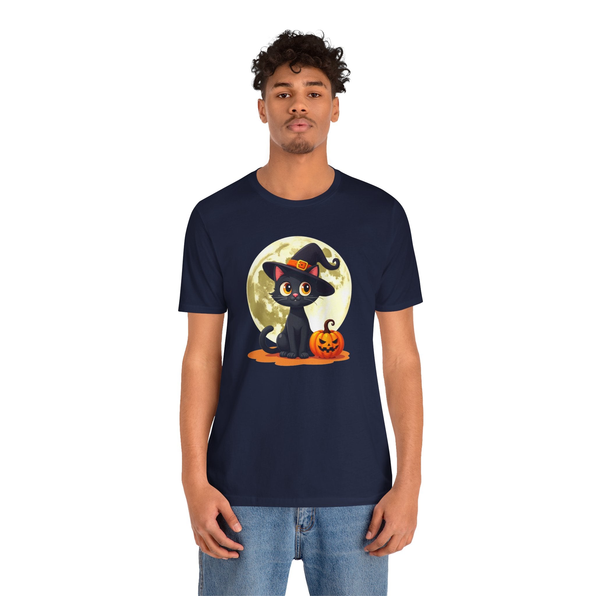 Person wearing a navy blue t-shirt with a Halloween design featuring a black cat and pumpkin.