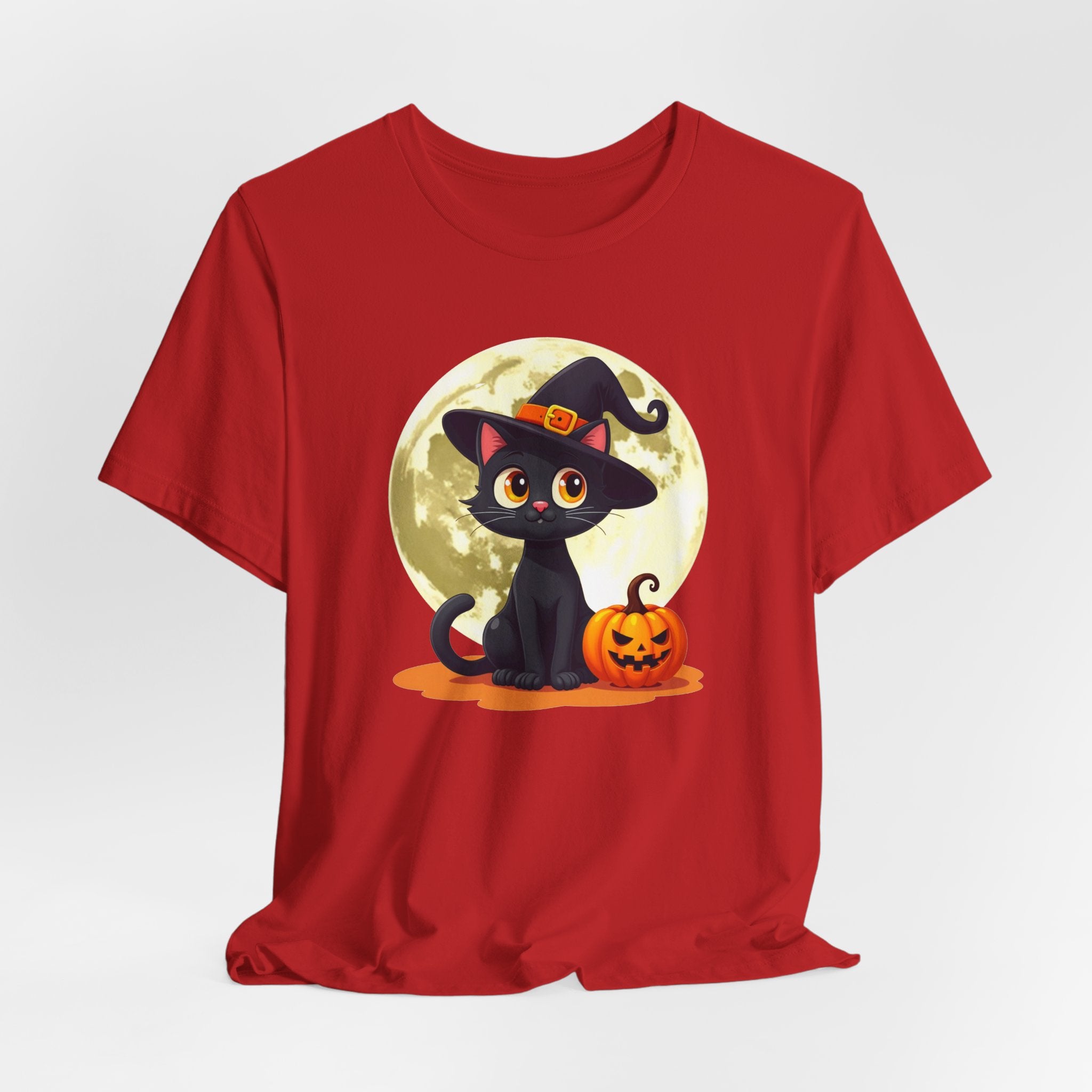 Red t-shirt with a Halloween design of a black cat, pumpkin, and moon on a white background